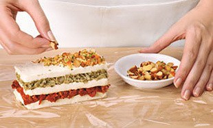 Layered-Sundried-Tomato-Artichoke-Spread-Step3 Layered-Sundried-Tomato-Artichoke-Spread-Step3