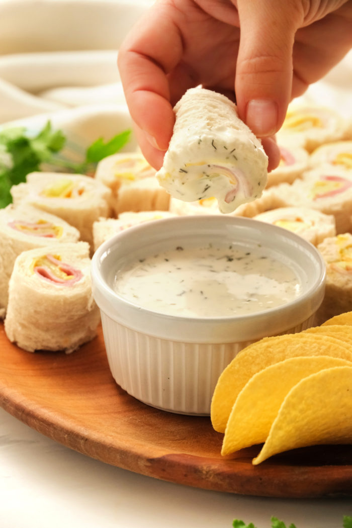 dipping a sandwich in Ranch dressing