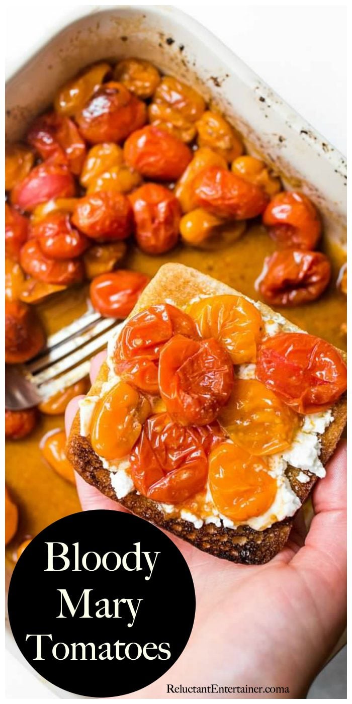 Pan of roasted Roasted Bloody Mary Tomatoes with a piece of toast, cheese, and tomatoes