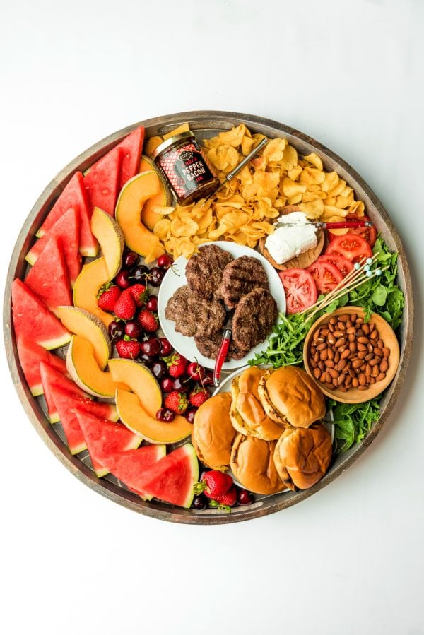 round burger board with patties in the center