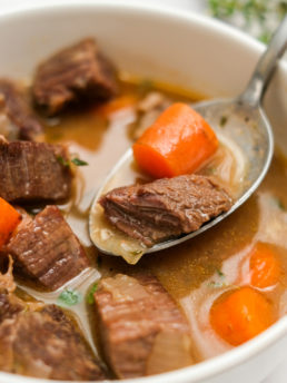 a bite of carrots and beef stew