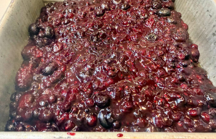 adding berries to 8x8 pan