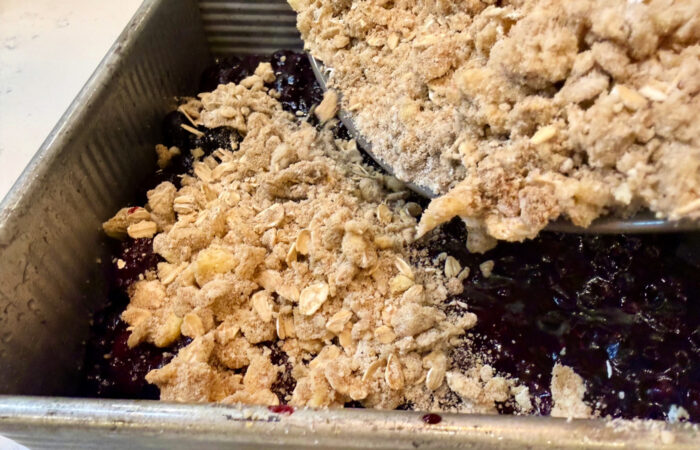adding a crisp topping to berries