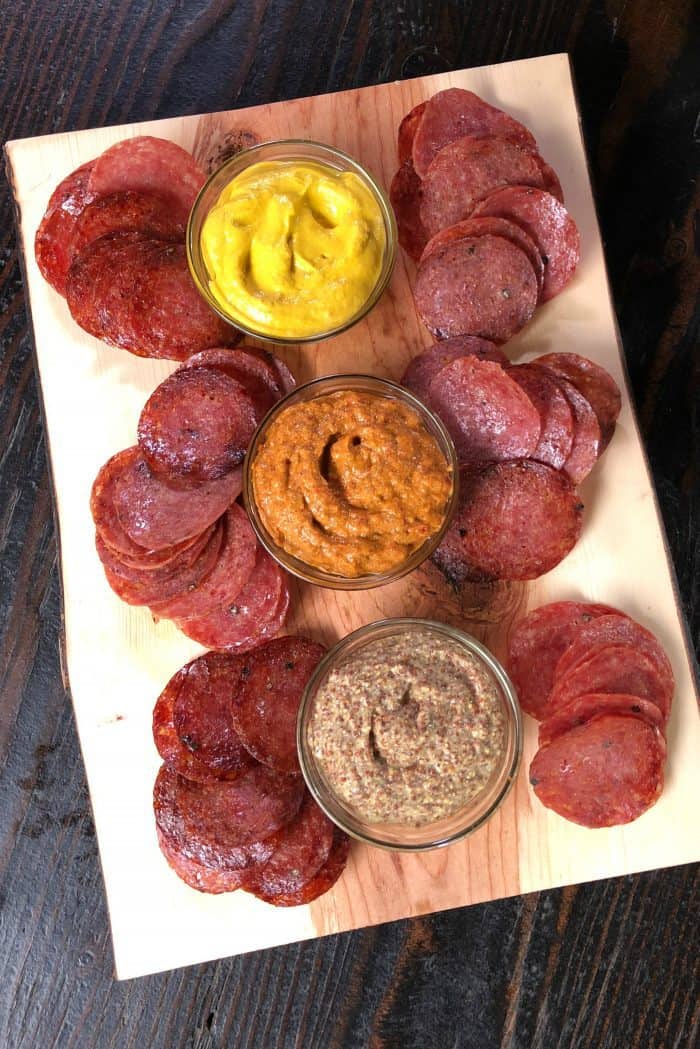 Easy Baked Salami Chips Served with Mustard