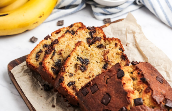 loaf of sliced Chocolate Chunk Bread with bananas