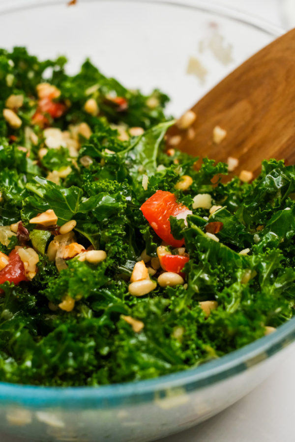 stirring kale salad