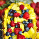 a pineapple boat recipe filled with fruit
