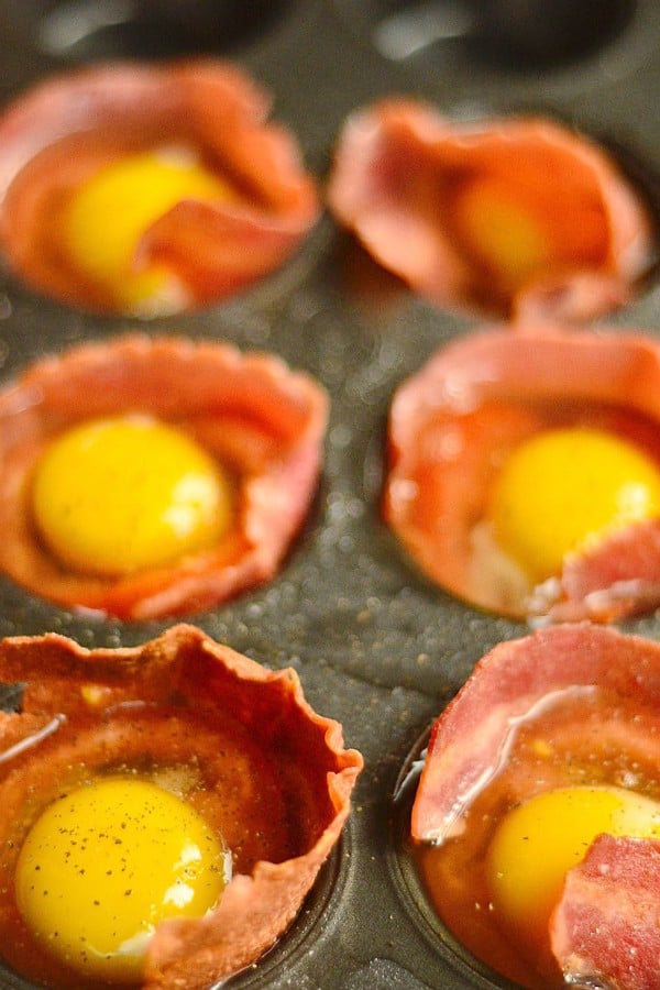 making Baked Egg Tomato Bacon Cups