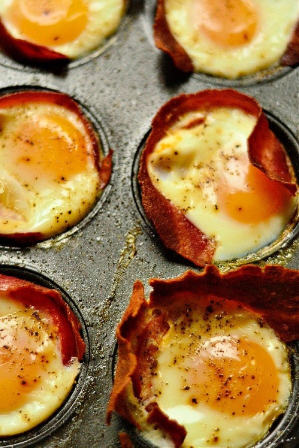 bacon egg tomato cups cooked in a muffin pan