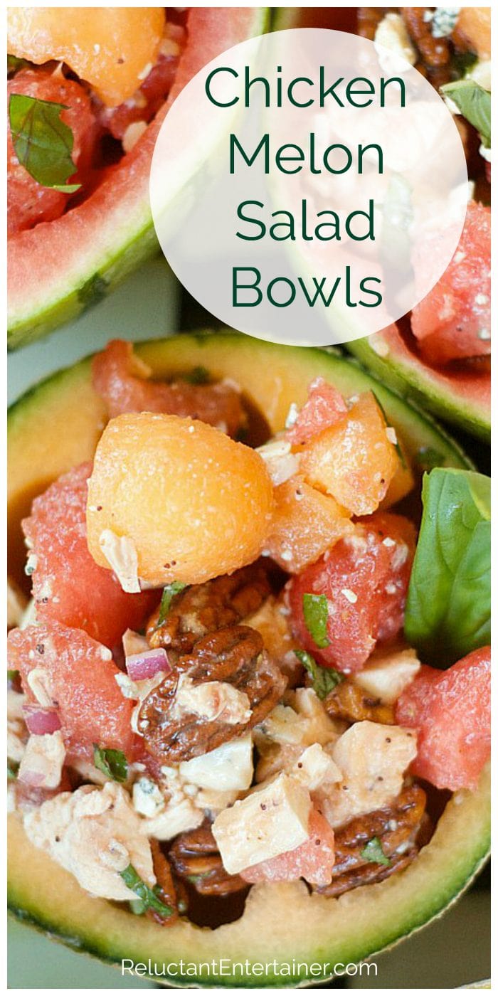 cantaloupe scooped out into a bowl filled with melon balls, chicken, pecans, and basil