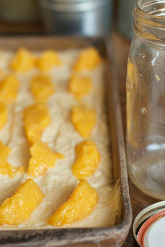 making Moist Peach Kuchen with canned peaches