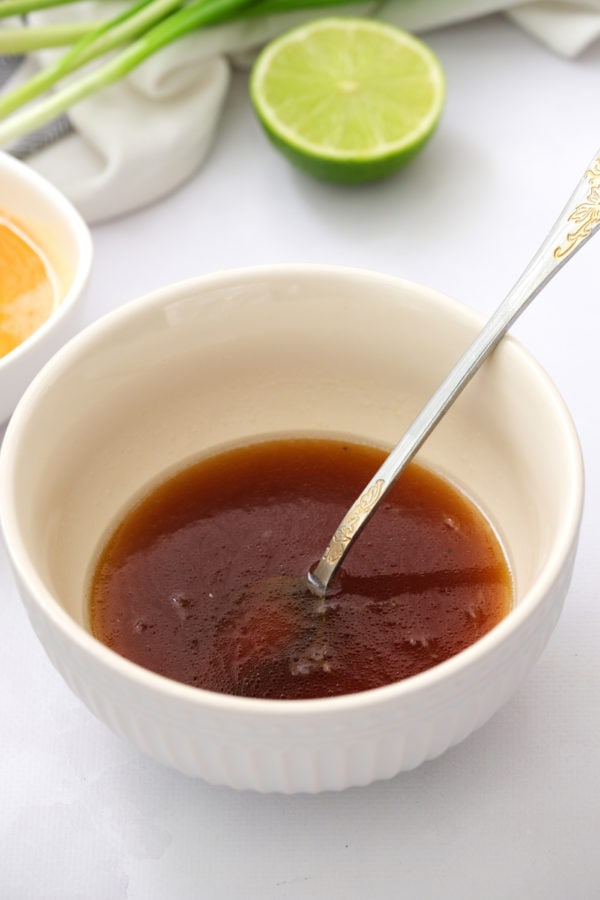 asian dressing in a bowl with a spoon