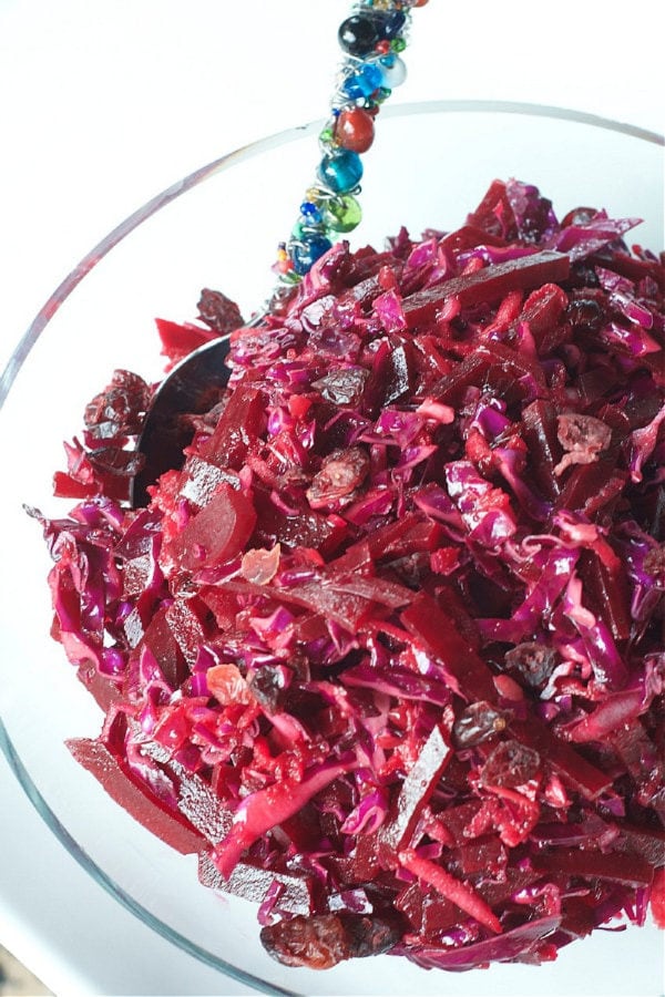 clear bowl of Red Cabbage Beet Slaw with Cranberries