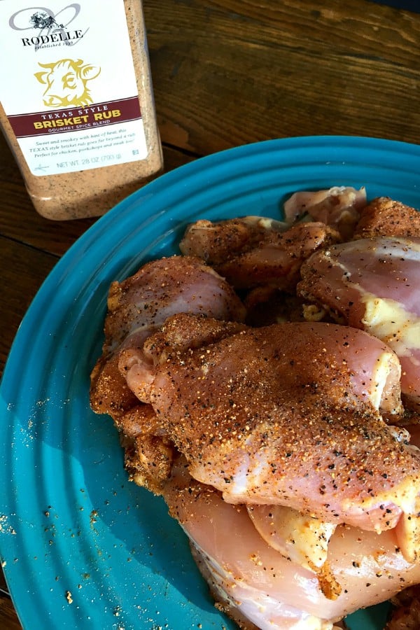 raw chicken thighs with seasoning
