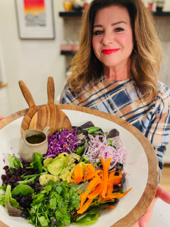 Woman holding a Dinner Party Salad