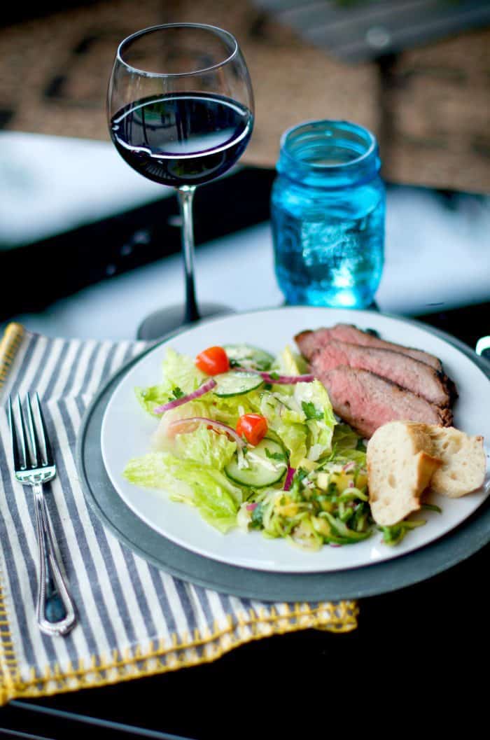 a beautiful plate of Grilled Garlic Pepper Tri Tip with salad and bread