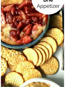 beautiful roasted strawberries on hot melted brie with crackers