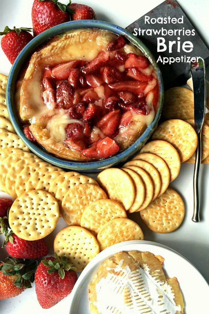 roasted strawberries on melted brie cheese in a round baking dish