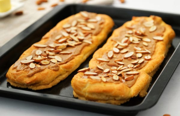 danish puff with salted caramel frosting and almonds