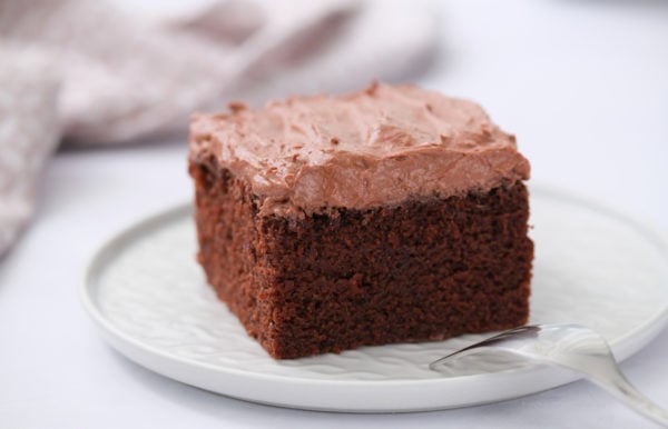 square piece of chocolate cake with buttermilk frosting
