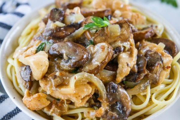 round bowl of pasta with chicken marsala on top