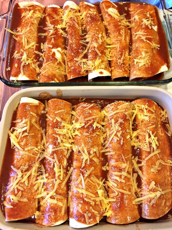 making and rolling up Cheesy Meat Enchiladas with homemade sauce