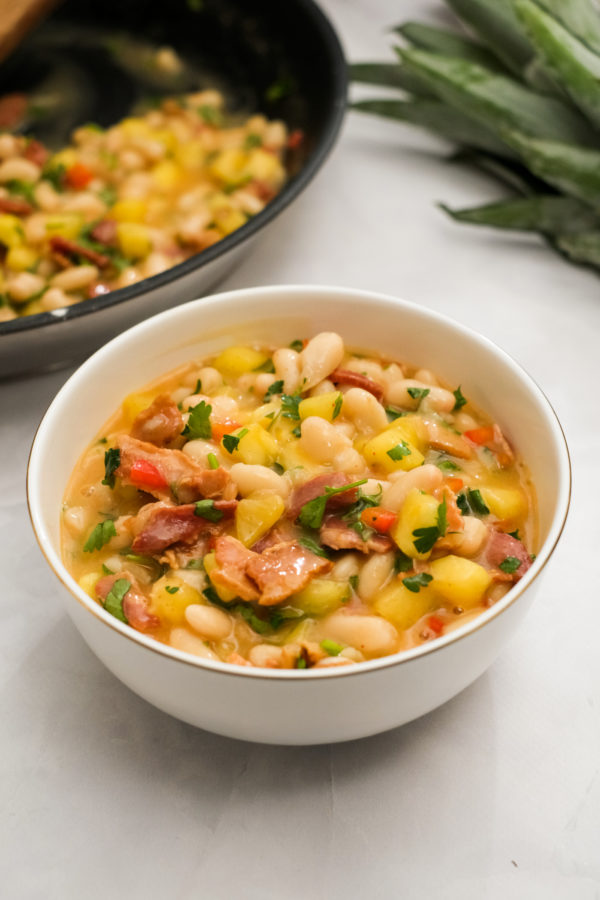 bowl of chili with pineapple and bacon