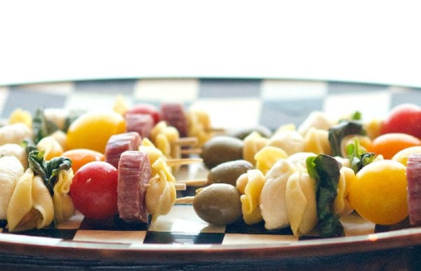 tortellini skewers on a checkered platter