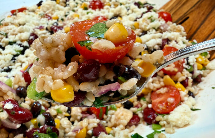 bite of Mexican Rice Salad with tomato