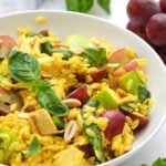 curried orzo salad in a white serving bowl
