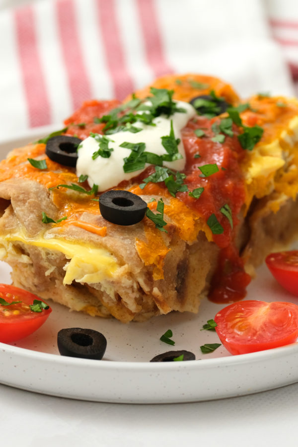 olives and toppings on Overnight Breakfast Sausage Enchiladas