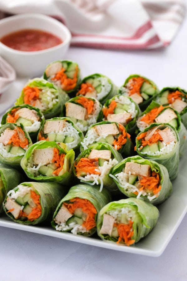 a plate of Summer Spring Rolls with dipping sauce