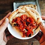 Roasted Tomato Tart is a great way to enjoy garden tomatoes by roasting them first, then cooking with goat cheese and fresh basil on puff pastry.