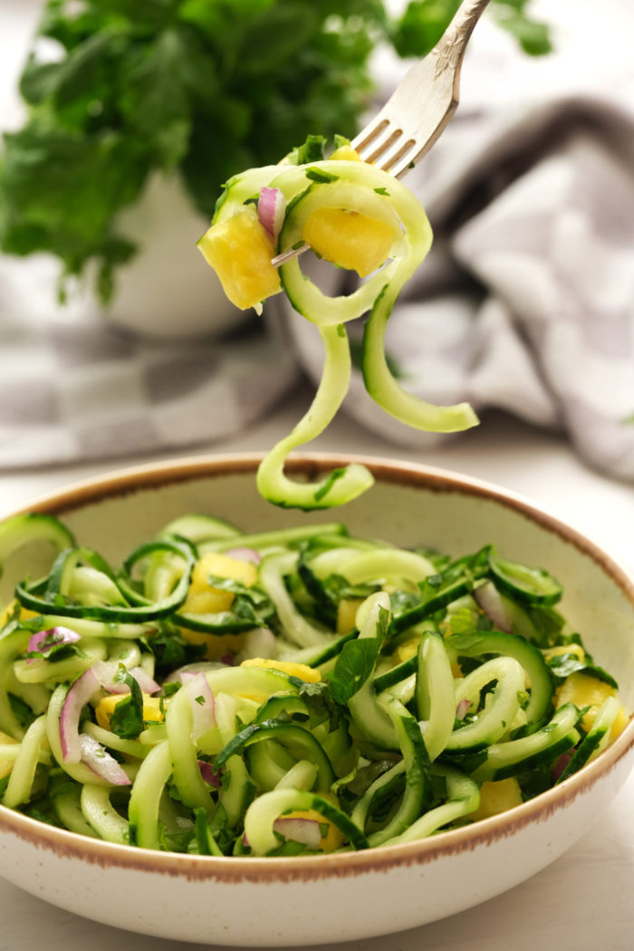 a bite of cucumber pineapple salad