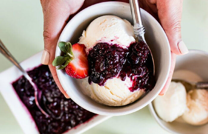 homemade ice cream with berry sauce
