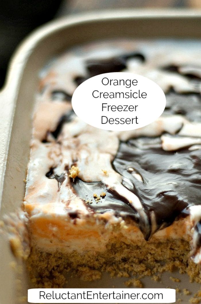 a pan of Orange Creamsicle dessert, with chocolate on top