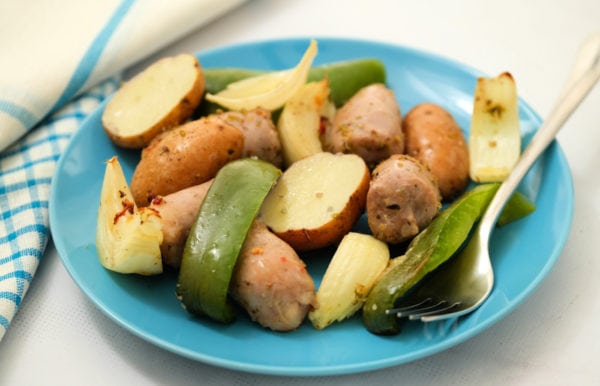blue plate of Roasted Bratwurst Potatoes and Peppers