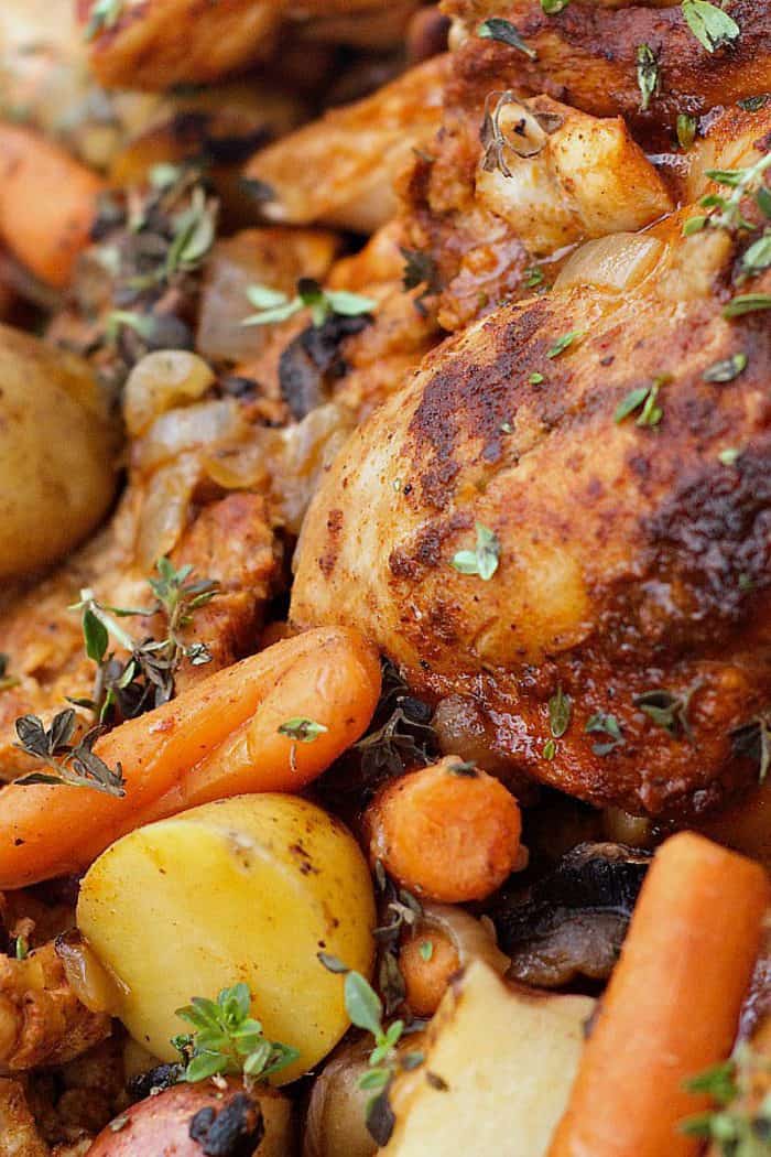 close up of a cooked chicken thigh in a paprika sauce