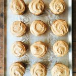 tray with 12 zucchini cupcakes with maple frosting