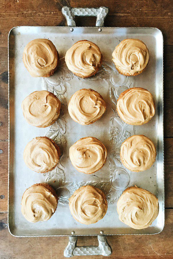 tray with 12 zucchini cupcakes with maple frosting