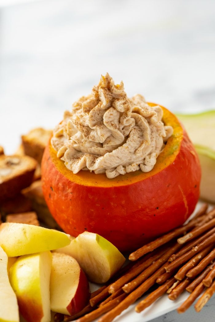 Easy Pumpkin Cream Cheese Dip served in small pumpkin