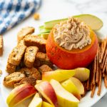 pumpkin cream cheese dip in small carved out pumpkin