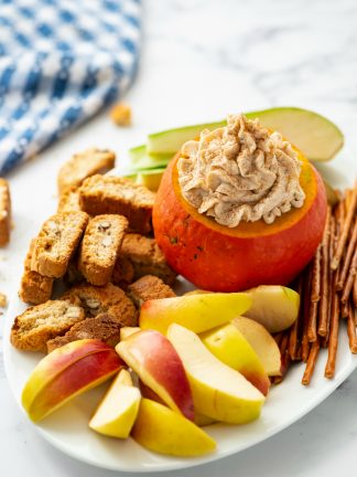 pumpkin cream cheese dip in small carved out pumpkin