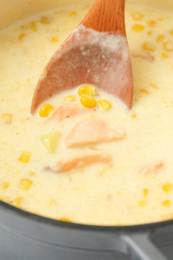 stirring corn salmon chowder