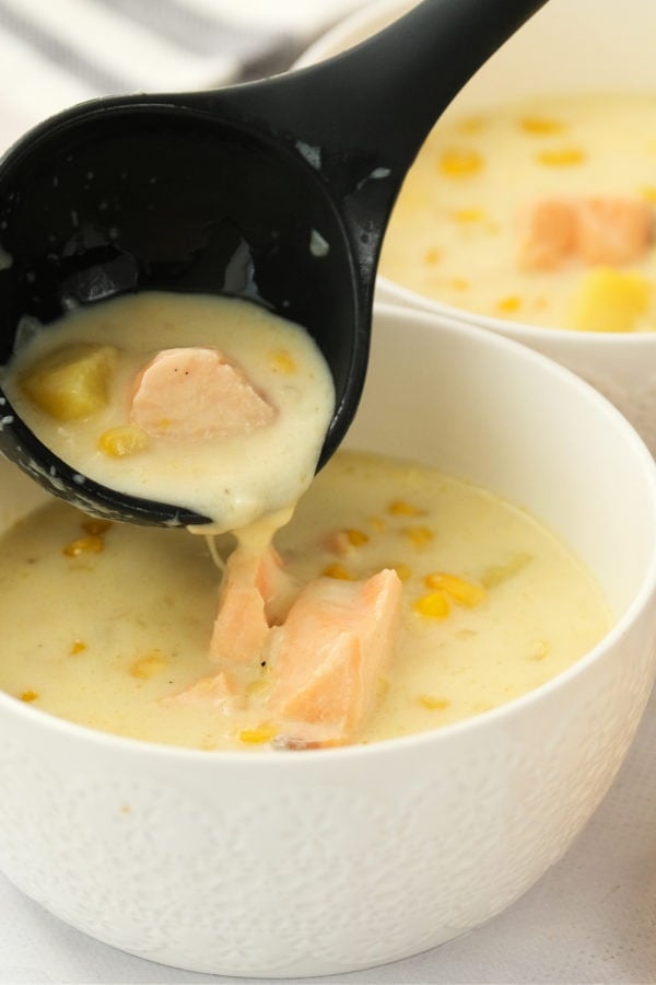 spooning in corn salmon chowder