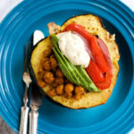 stuffed acorn squash with chickpeas, veggies, tahini