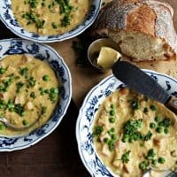 3 bowls of Red Lentil Ham Carrot Soup with bread