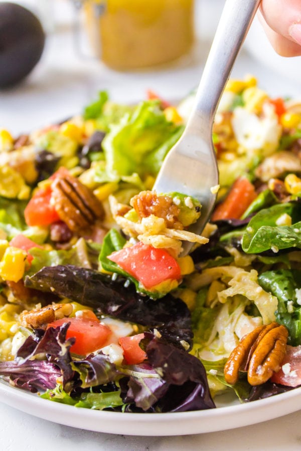 taking a bite of southern cobb salad