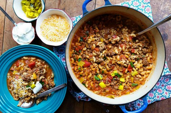 pot of Cheeseburger Dill Pickle Soup with toppings 