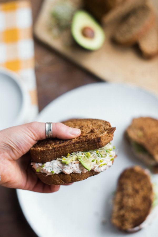 holding a Leftover Lemon Dill Salmon Sandwiches